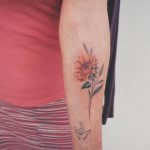 Minimalist sunflower tattoo