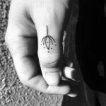 Minimalist sunflower tattoo by Nadia Rose