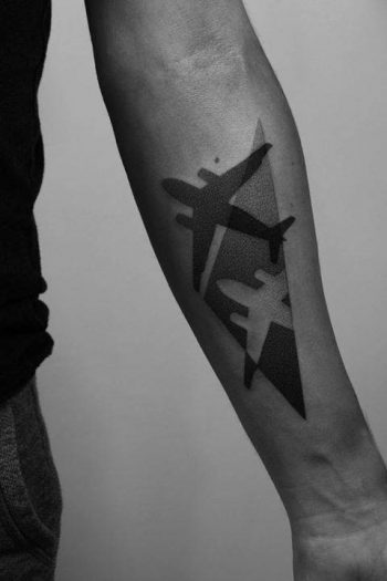 Negative space airplane tattoo