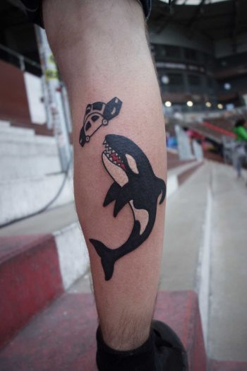 Orca and police car tattoo