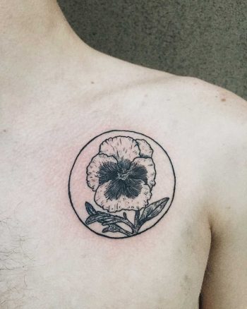 Pansy tattoo on the chest by Finley Jordan