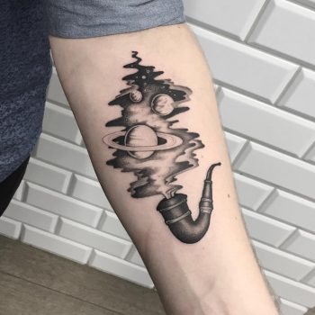 Pipe with cosmic smoke tattoo