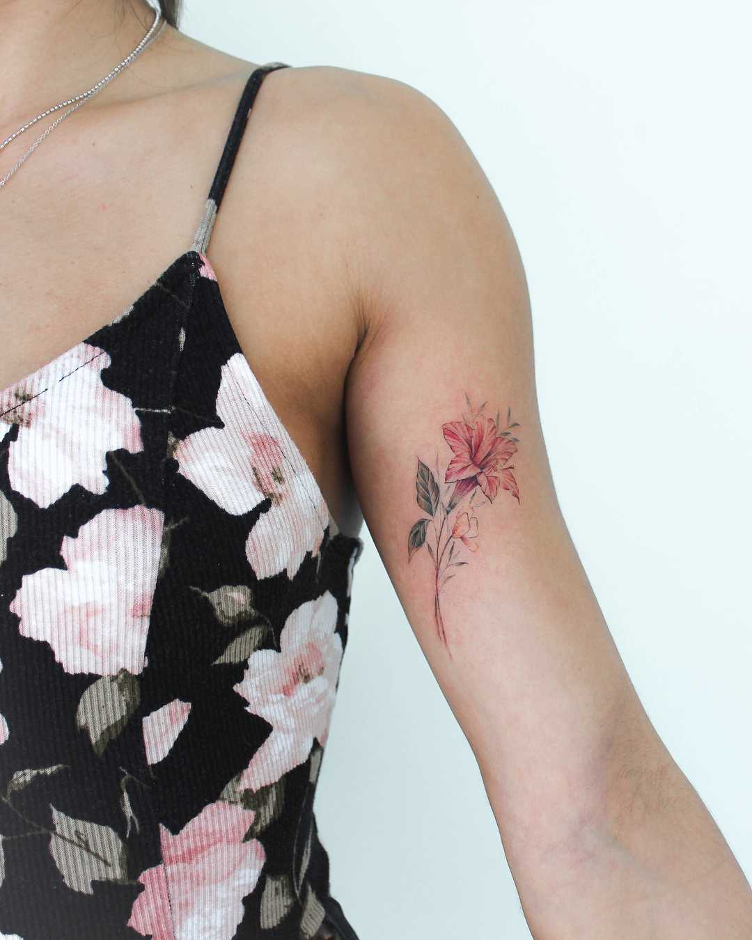 Red flower tattoo by Iris Art
