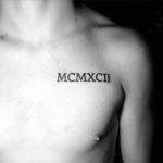 Roman numerals MCMXXII tattoo