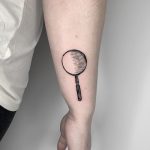 Sherlock Holme's magnifying glass tattoo by Conz Thomas