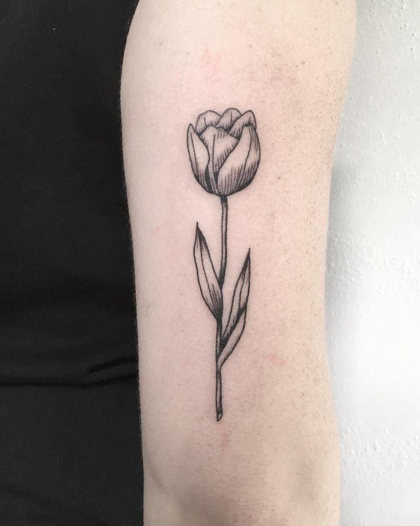 Simple black and grey rose tattoo