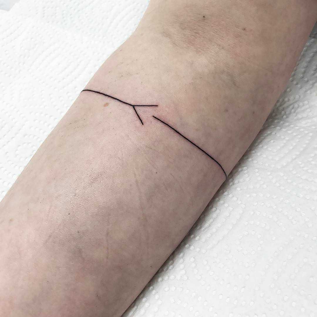 Simplistic armband tattoo by Jay Rose