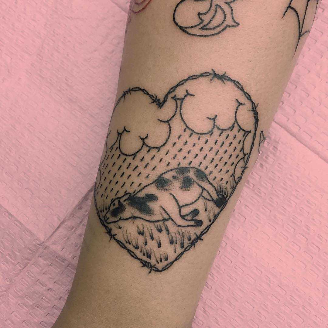 Sleeping calf tattoo by Jen Wong