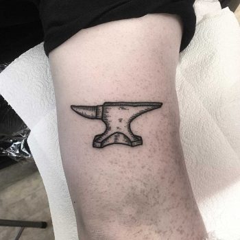 Small anvil tattoo by Deborah Pow