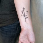 Small chamomile tattoo