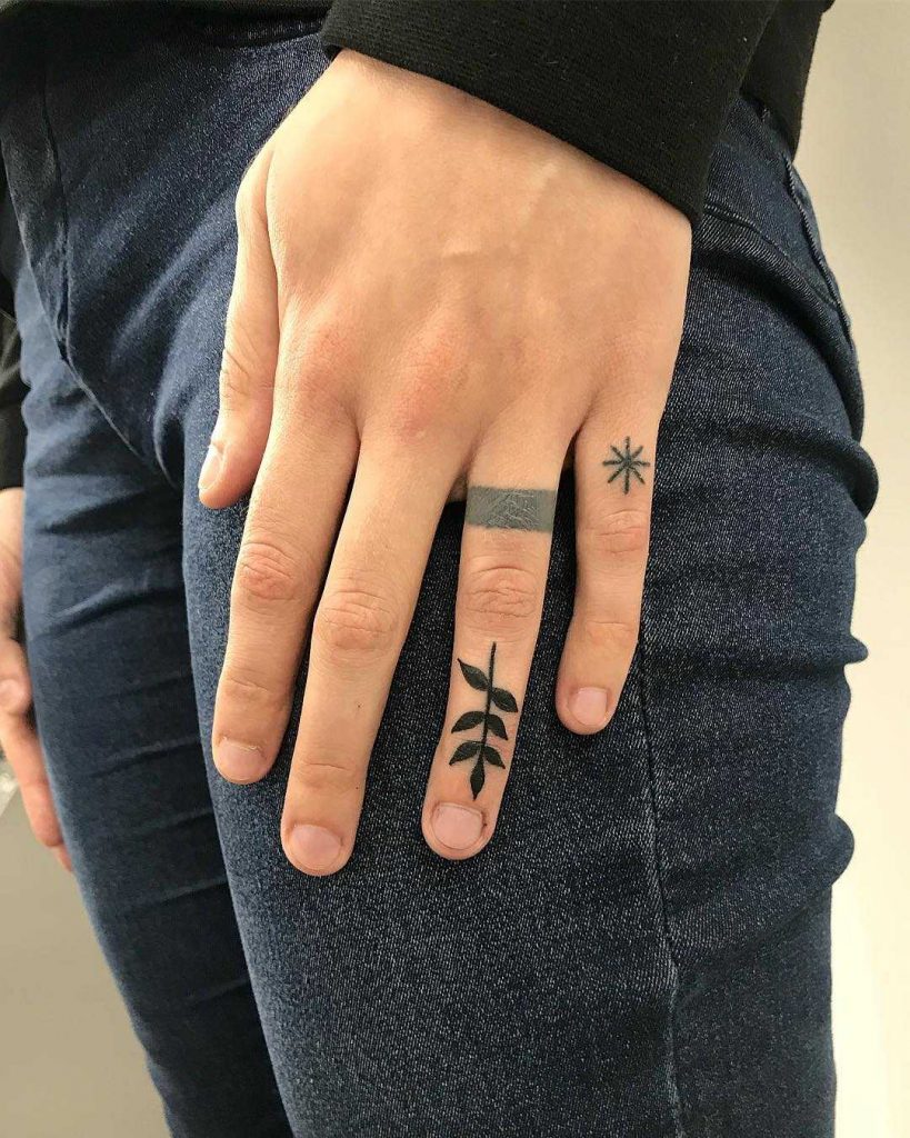 Small finger tattoo by Łukasz Krupiński