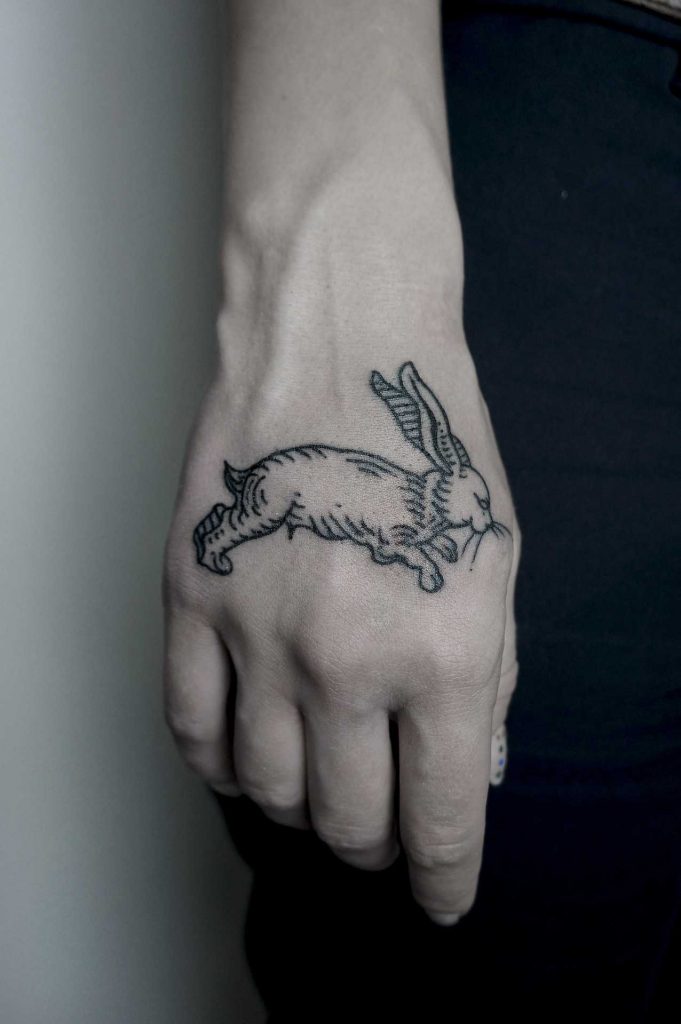 Small rabbit tattoo by Andrei Svetov - Tattoogrid.net