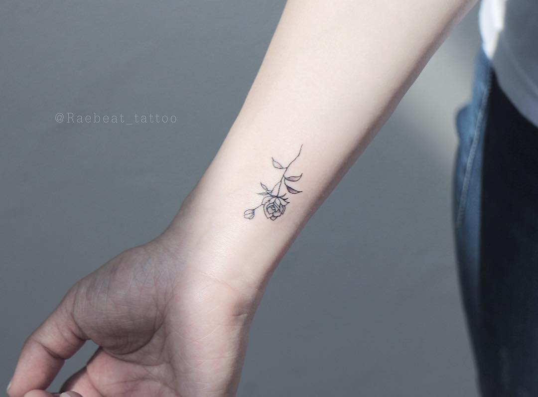 Small rose tattoo on the wrist