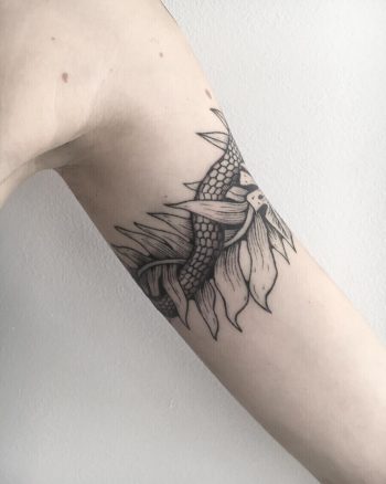 Snake and leaves tattoo