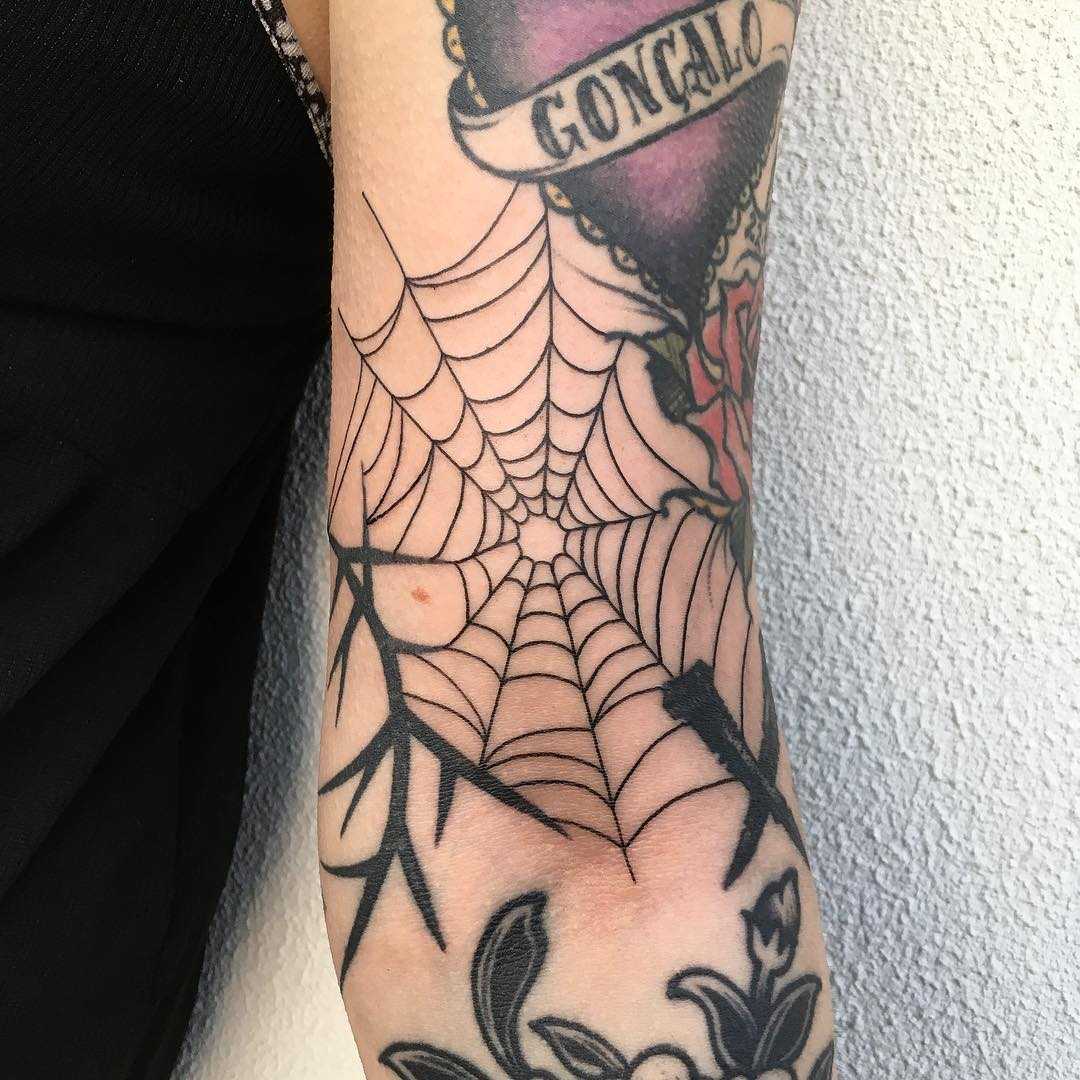 Spider web, thorns and nail tattoo by Agata Agataris
