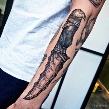 Stone dagger tattoo