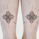 Symmetrical pattern tattoos