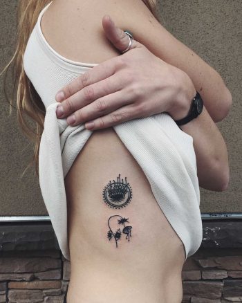 Tiny botanical tattoos on the rib