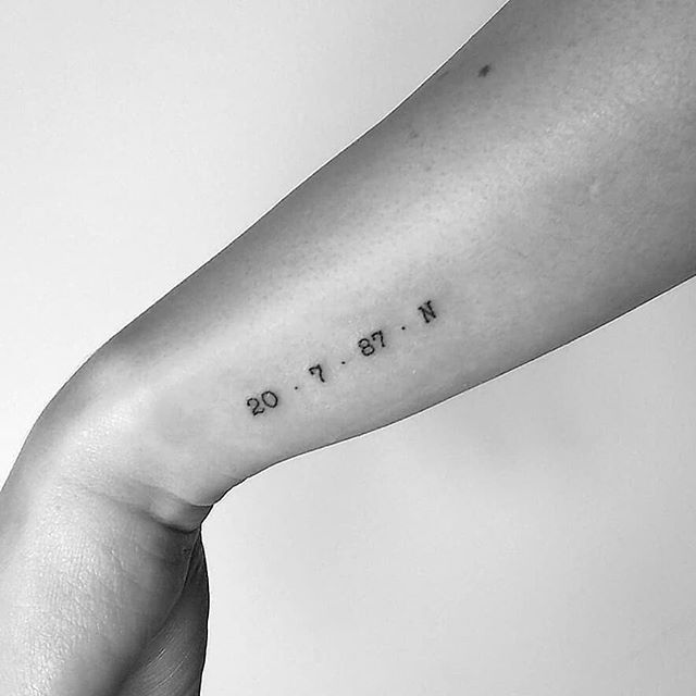 Tiny coordinates on the left forearm - Tattoogrid.net