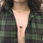 Tiny flower on the sternum by Jen Wong