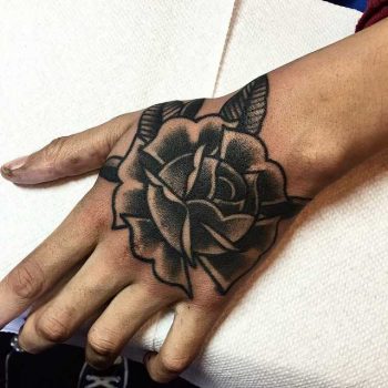 Traditional blackwork rose tattoo