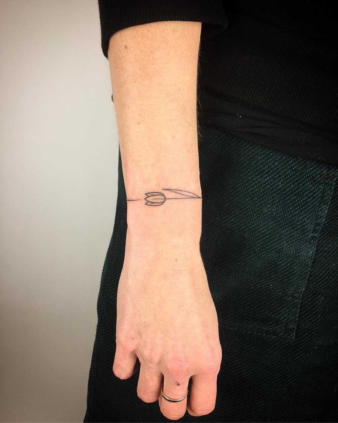 Tulip bracelet tattoo by Kirk Budden