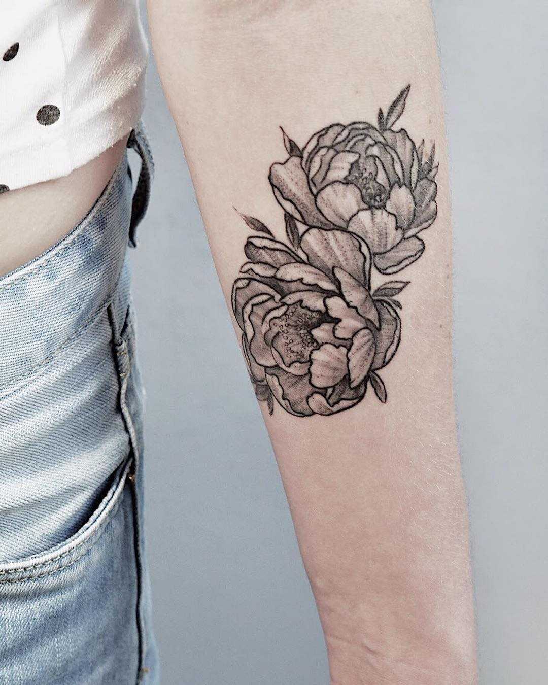 Two black and grey peony tattoos