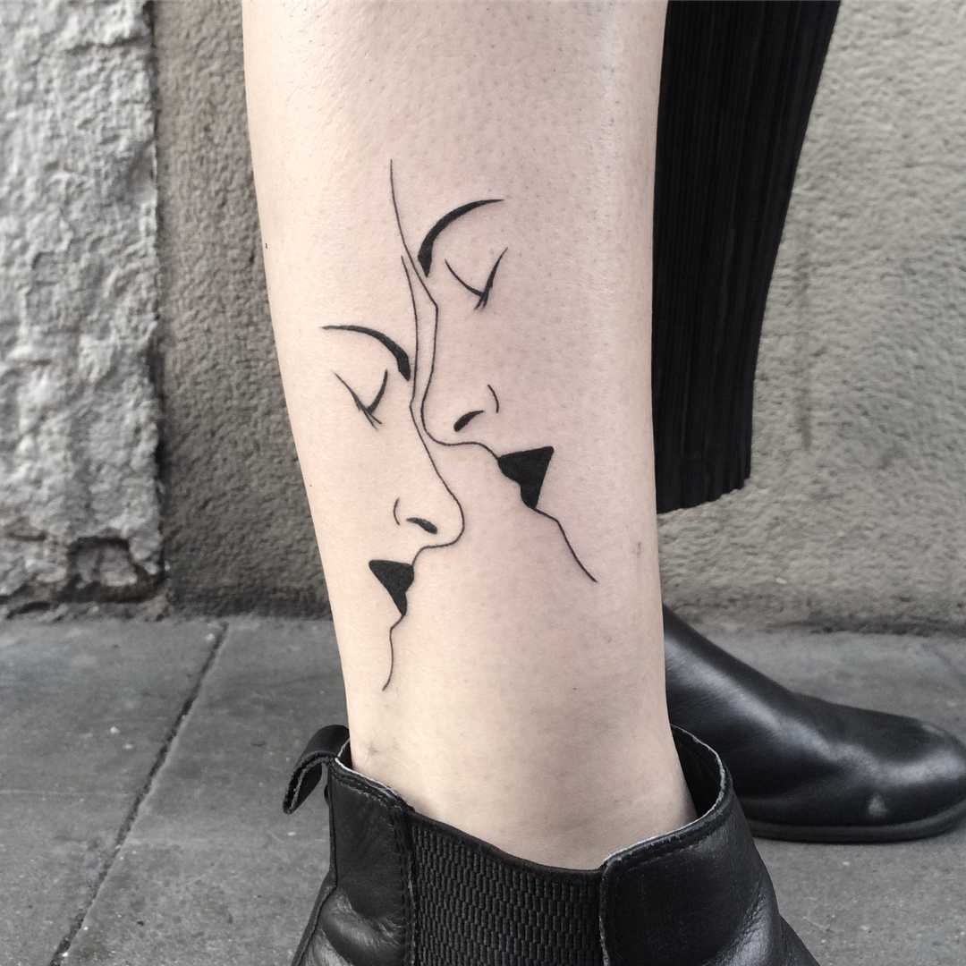 Two faces tattoo