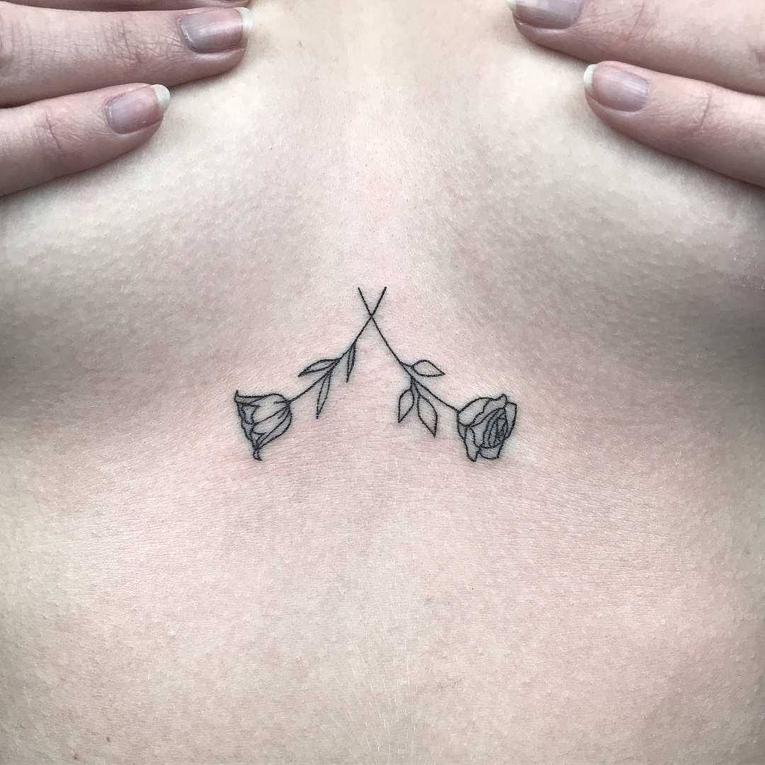 Two tiny roses by Femme Fatale Tattoo
