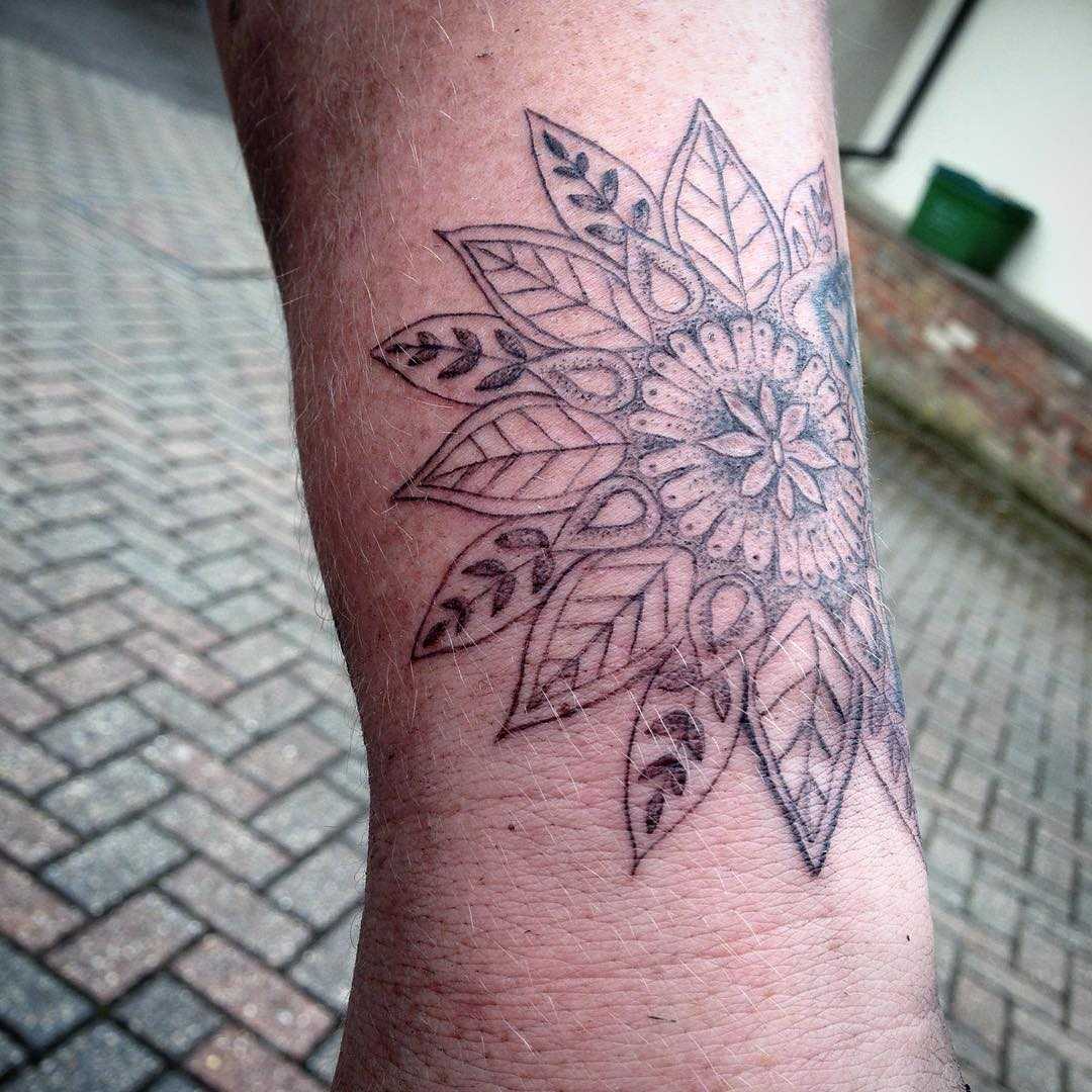 White and black mandala tattoo