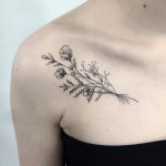 Wildflower bundle tattoo on the collarbone