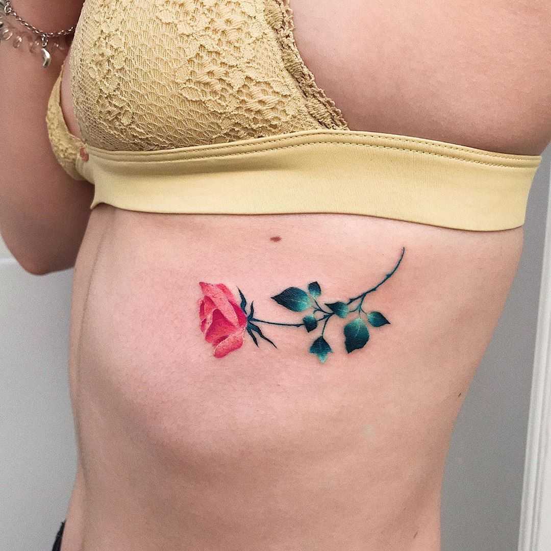 A small rose tattoo by Valeria Yarmola