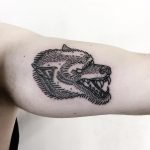Angry wolf tattoo by Deborah Pow