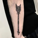 Arrow tattoo on the forearm by Deborah Pow