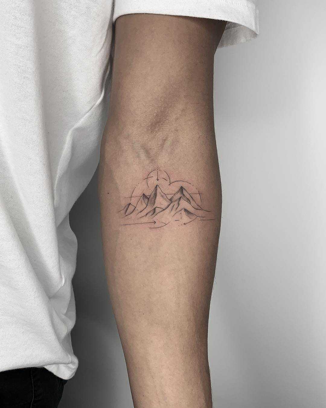 minimalist mountain tattoo back