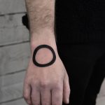 Black circle tattoo by Wagner Basei