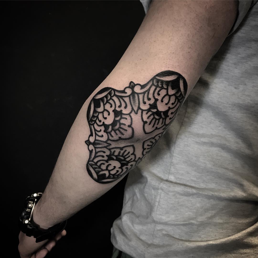 Black elbow tattoo by Jaya Suartika