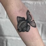 Black telescope fish tattoo by Lozzy Bones