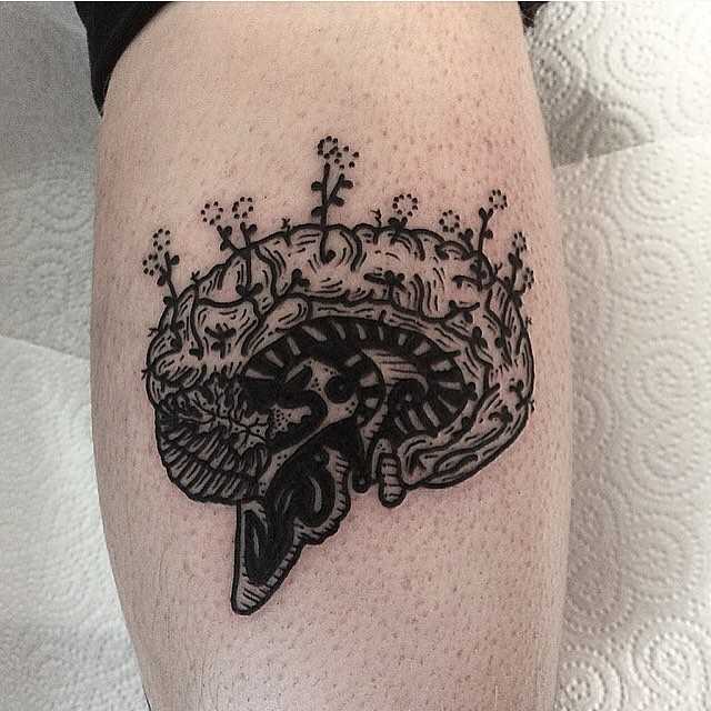 Brain tattoo on a calf by Deborah Pow