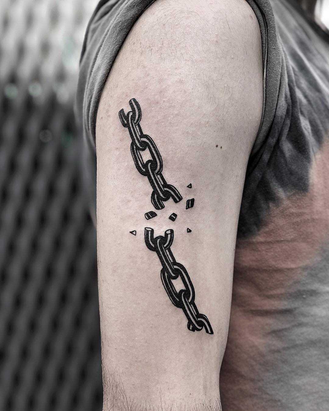 Broken chain tattoo by Loz McLean