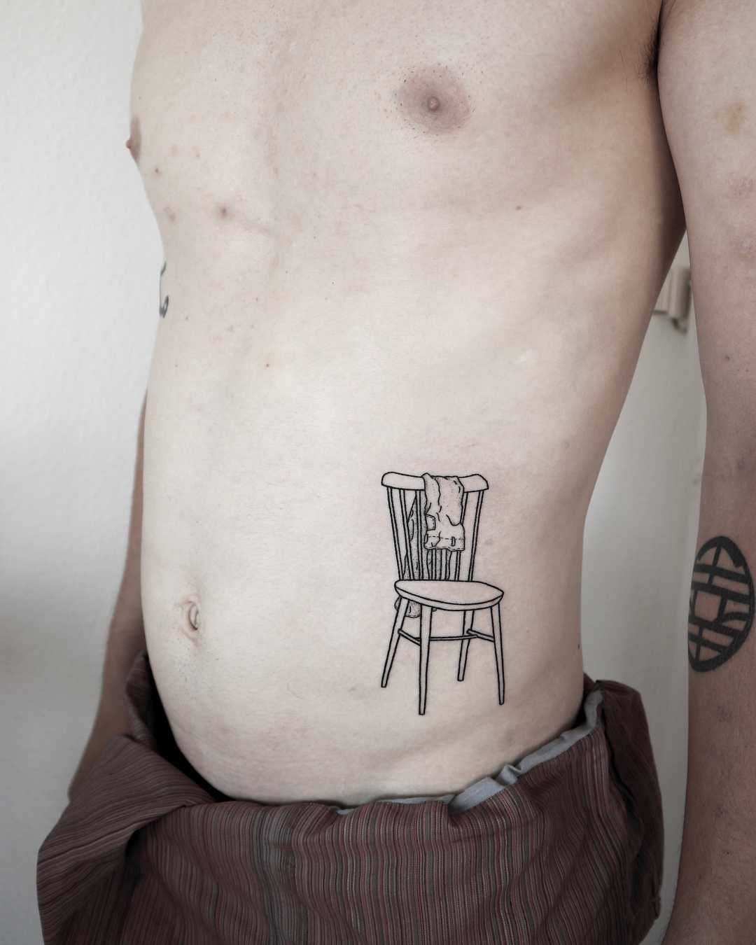 Chair with pants tattoo by Ann Gilberg