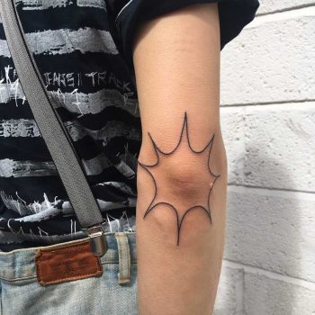 Explosion tattoo on the elbow by Jessica Rubbish