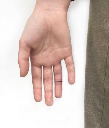 Finger band tattoo by Gianina Caputo