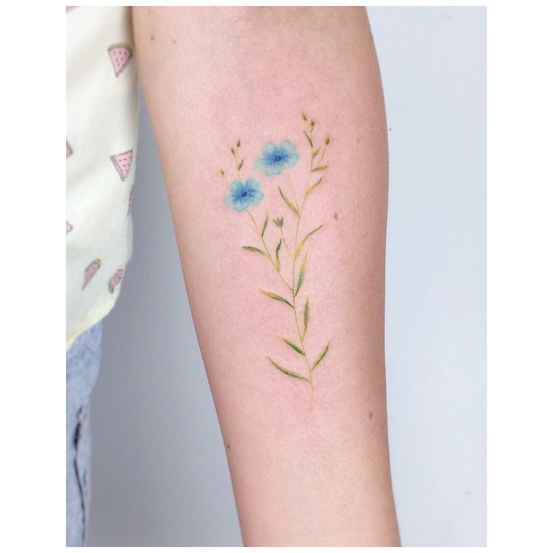 Flax flower tattoo by Jakub Nowicz