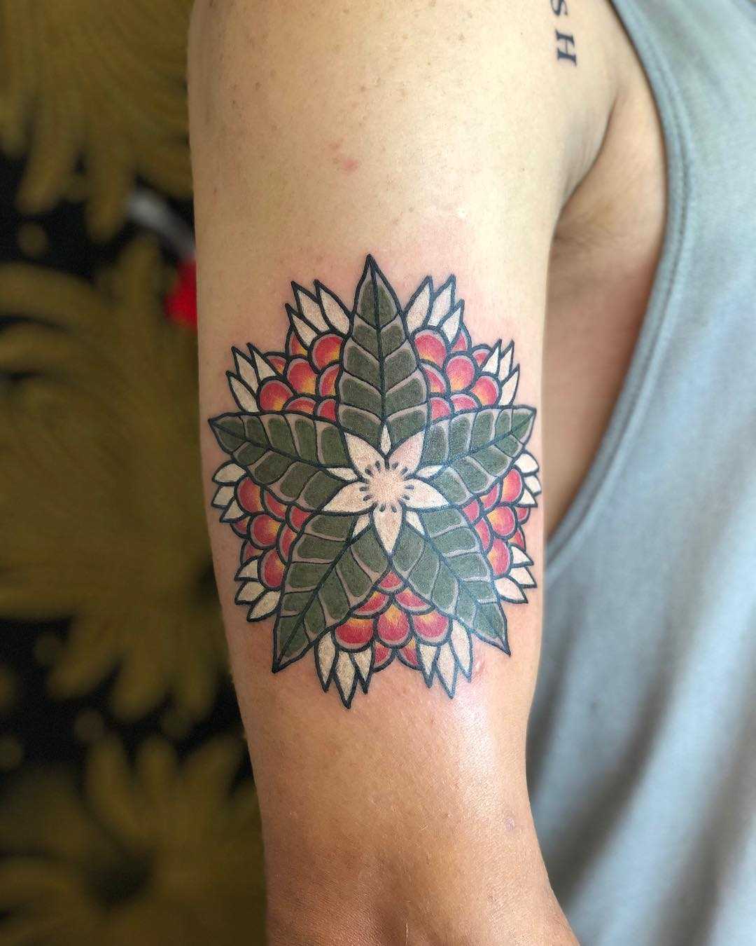 Green and red flower by tattooist Jayaism