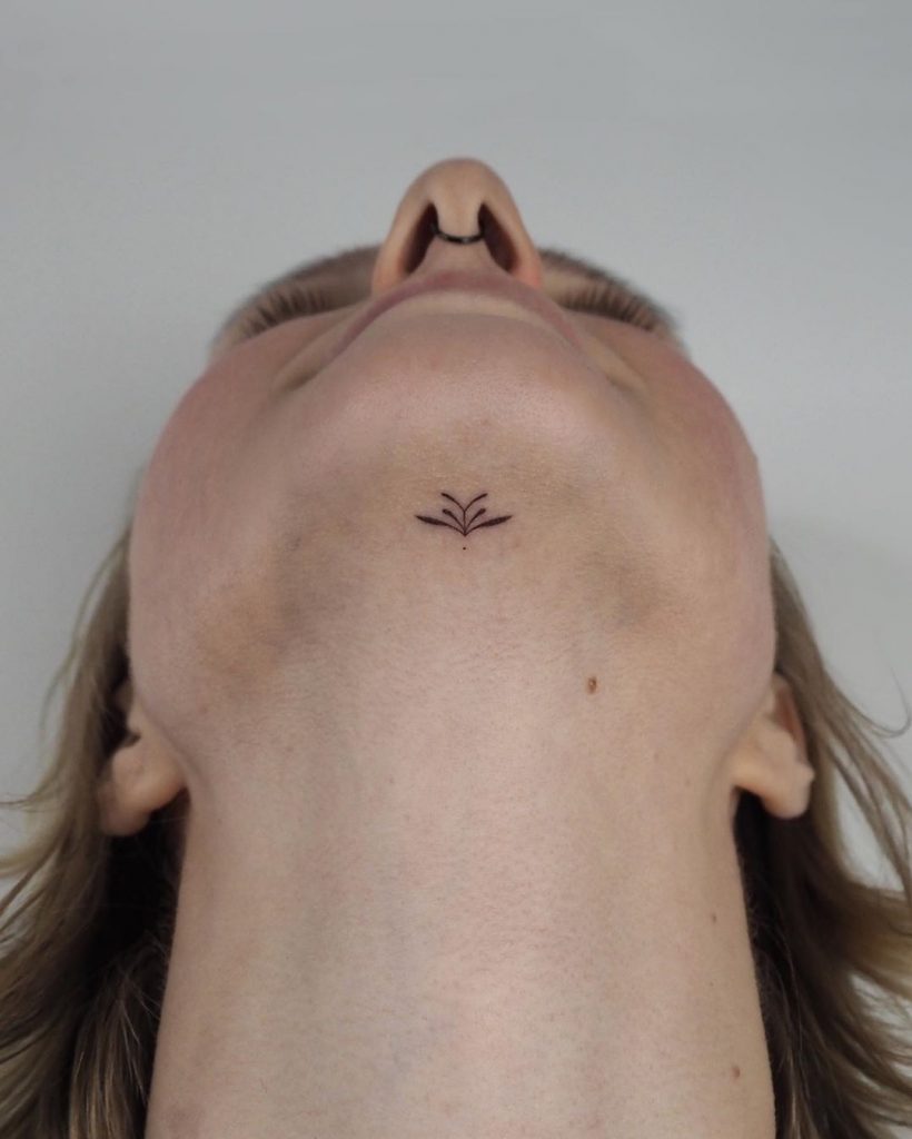 Hand-poked chin tattoo by Lara Maju