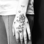 Hand-poked dragon tattoo by Nadia Rose