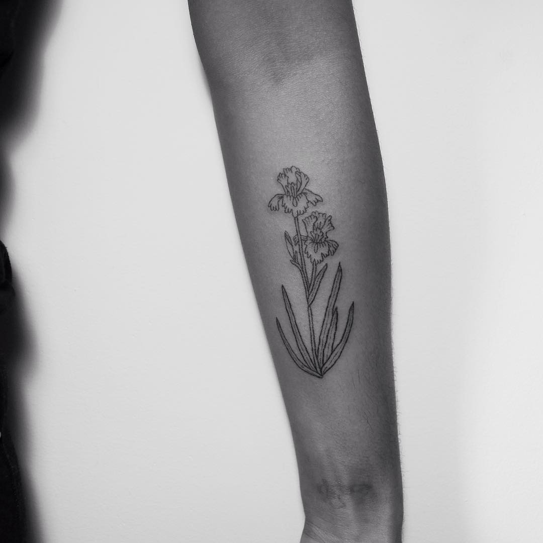 Hand-poked iris tattoo by Kelli Kikcio