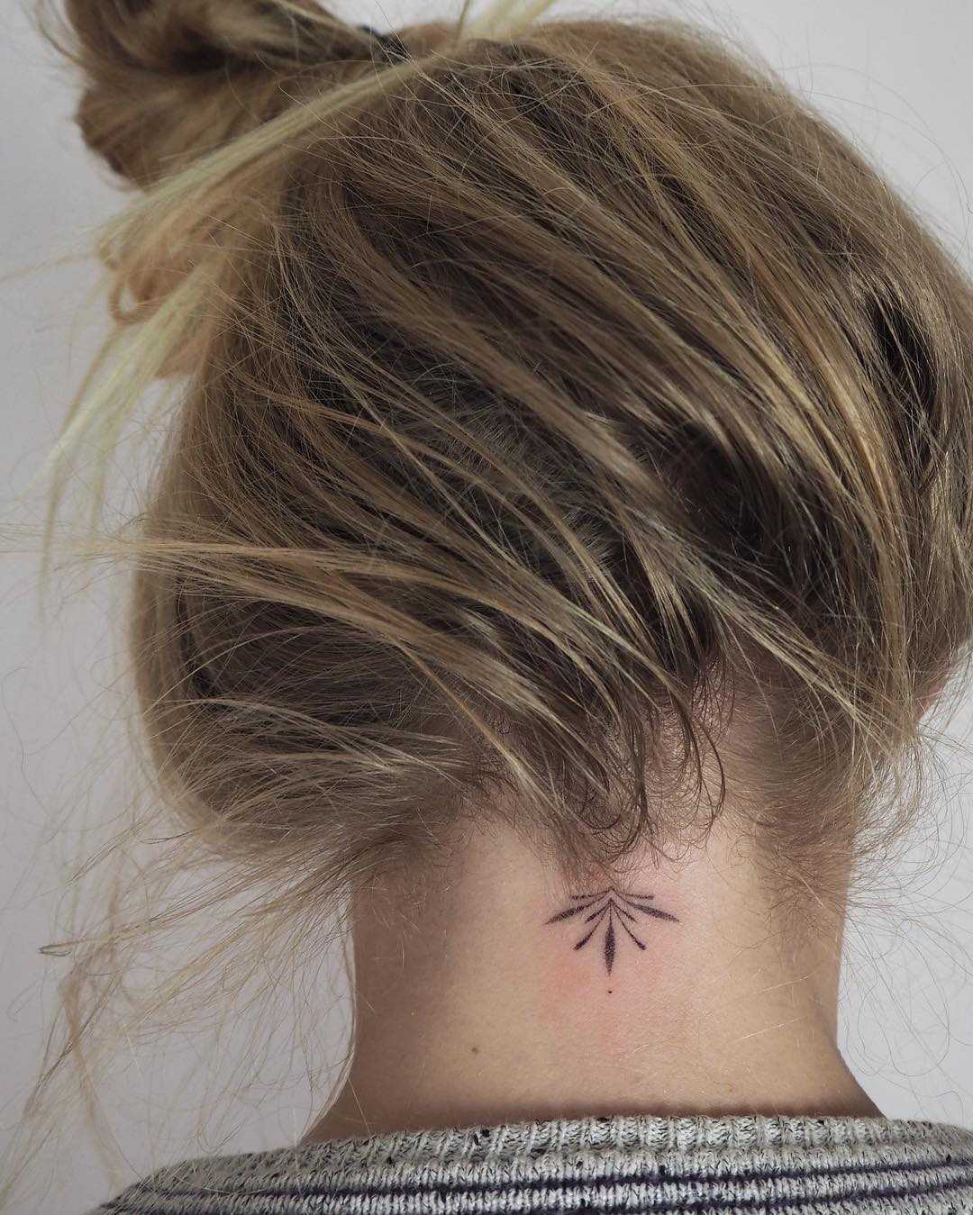 Hand-poked neck ornament by Lara Maju