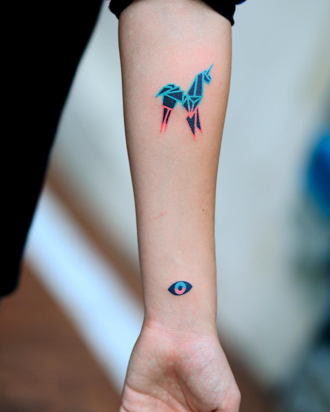 Hand-poked paper unicorn and eye tattoos by zzizziboy